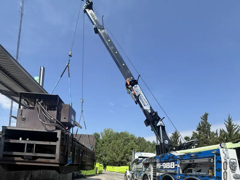 Rotator boom lifting heavy equipment